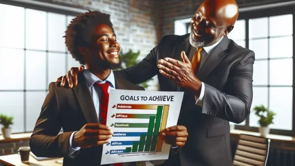 una persona che si congratula con un ragazzo in un ufficio, l'immagine rappresenta il corso di life coach e psicologia del lavoro